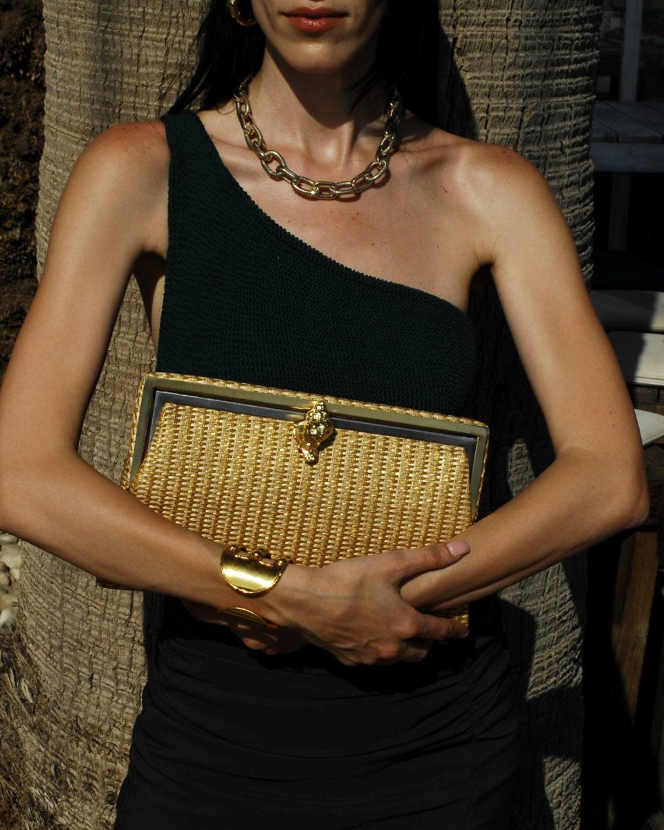 murex gold straw grace clutch bag on model