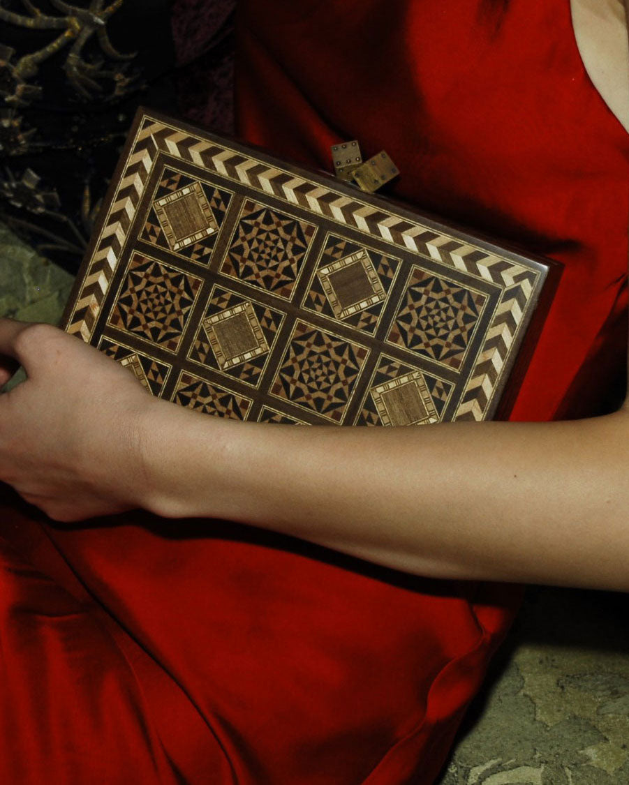 Side view of Dama Bag Handcrafted clutch showcasing detailed geometric patterns and inlaid design by Sarah's Bag