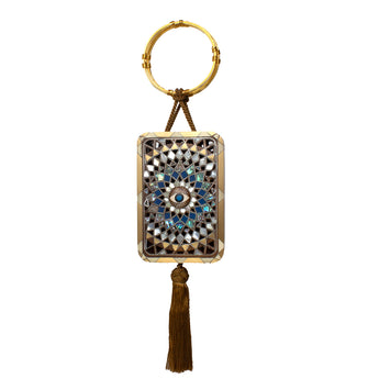 Decorative keychain with geometric pattern and tassel on a white background
