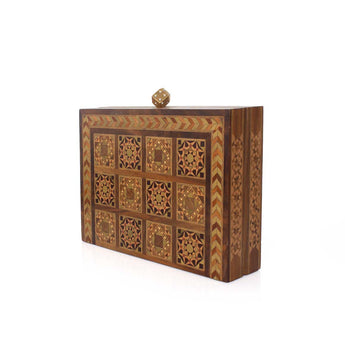 Wooden box bag with intricate geometric patterns on a white background