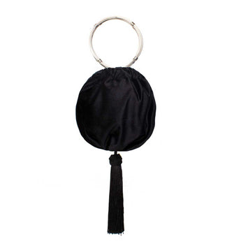 Black round clutch with a tassel and silver ring handle on a white background