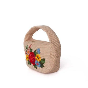 Canvas handbag with colorful floral embroidery on a white background
