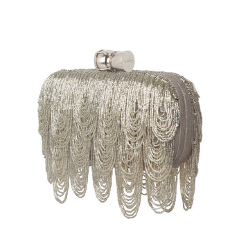 Silver beaded clutch with a champagne cork bag on a white background