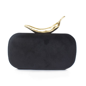 A black velvet clutch with a gold chili-shaped clasp.