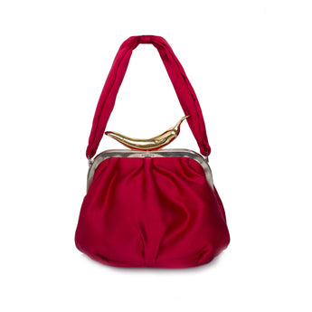 A red handbag with a metallic clasp and a textured surface.