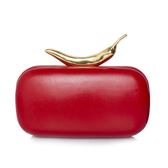 A red clutch bag with a sleek finish and a gold-dipped clasp shaped like a chili pepper.