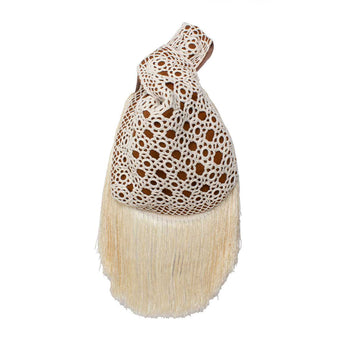 White crocheted clutch bag on havane  slip bag on a white background