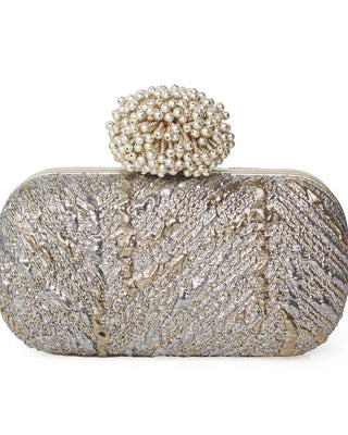 Elegant clutch bag with a decorative dhalia clasp on a white background