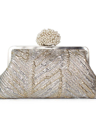 Silver and gold clutch with a pearl embellishment clasp on a white background