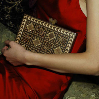 Side view of Dama Bag Handcrafted clutch showcasing detailed geometric patterns and inlaid design by Sarah's Bag