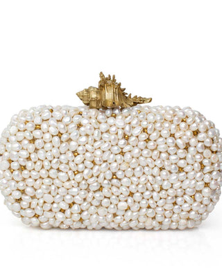 Pearl-clad clutch with a gold shell on a white background