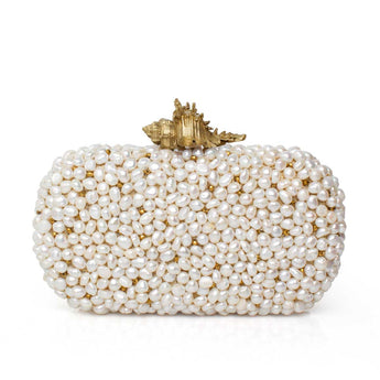 Pearl-clad clutch with a gold shell on a white background