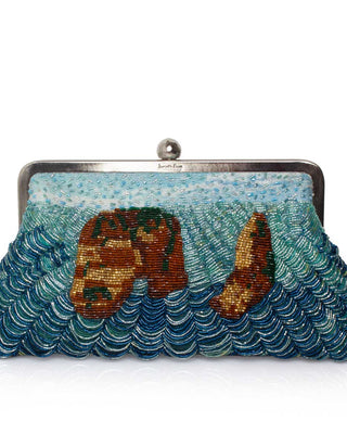 A beaded clutch bag featuring a rock design in shades of blue, teal, and gold, framed by a silver-tone metal clasp on a white background.