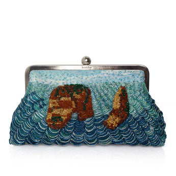 A beaded clutch bag featuring a rock design in shades of blue, teal, and gold, framed by a silver-tone metal clasp on a white background.