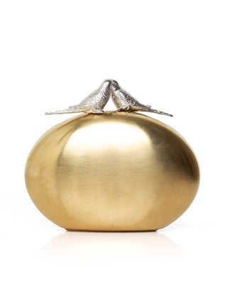 Gold oval clutch with two silver bird on top on a white background