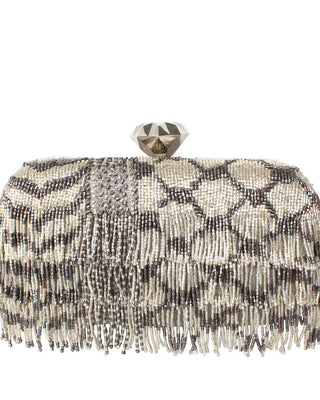 Beaded keffiyeh design clutch with fringes detail on a white background