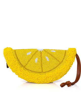 A bright yellow beaded clutch purse designed in the shape of a lemon slice, featuring white bead accents and a brown leather wrist strap, set against a plain white background.