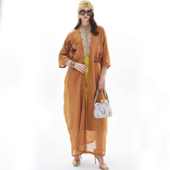 MONOCHROME BIRD OF PARADISE ON RUST ABAYA