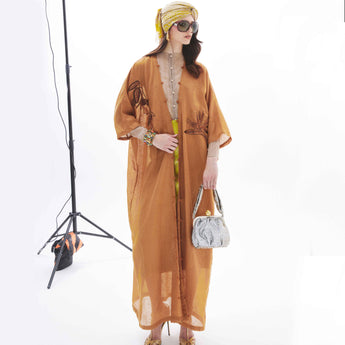 MONOCHROME BIRD OF PARADISE ON RUST ABAYA