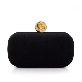 Black clutch with a gold moon clasp on a white background