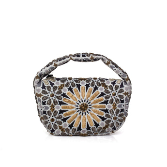 Handbag with a decorative Moroccan pattern on a white background