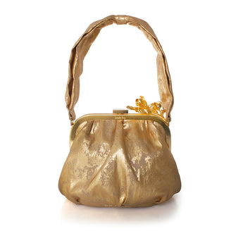 Gold handbag with floral details on a white background