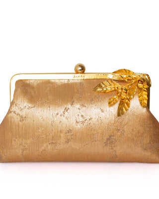 Gold clutch purse with leaf detail on a white background