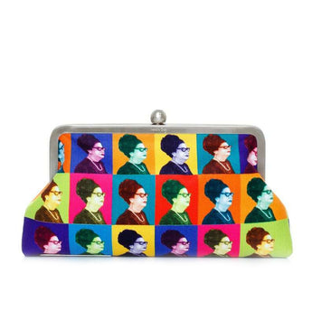 A multicolored handbag featuring a pattern with multiple images of a oum kalthoum face in bold Warhol-inspired colors.