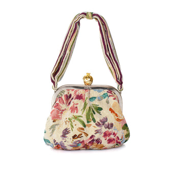 Floral handbag with a striped handle on a white background