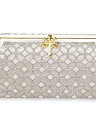 A silver clutch handbag with a geometric pattern and a palm shaped clasp, designed in a vintage style.