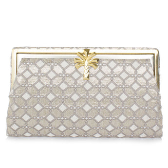 A silver clutch handbag with a geometric pattern and a palm shaped clasp, designed in a vintage style.