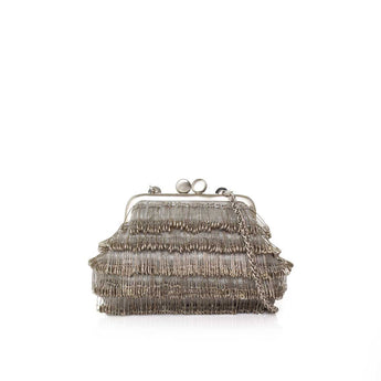 Metallic clutch bag with frayed edges on a white background