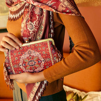Model holding the Tapestry Red Classic Bag, red tapestry clutch