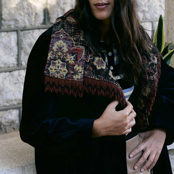 Model wearing the Woven Tapestry on Black Velvet Yas Jacket, black velvet jacket with tapestry panels