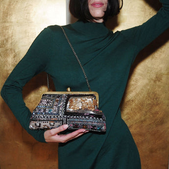 bedouin classic clutch bag with shoulder chain on model
