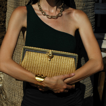 murex gold straw grace clutch bag on model