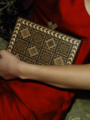 Side view of Dama Bag Handcrafted clutch showcasing detailed geometric patterns and inlaid design by Sarah's Bag